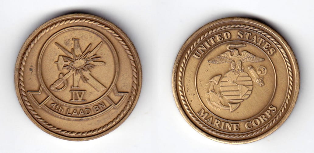 Round shaped coin, antique brass in color, 1 1/2 inches in diameter.