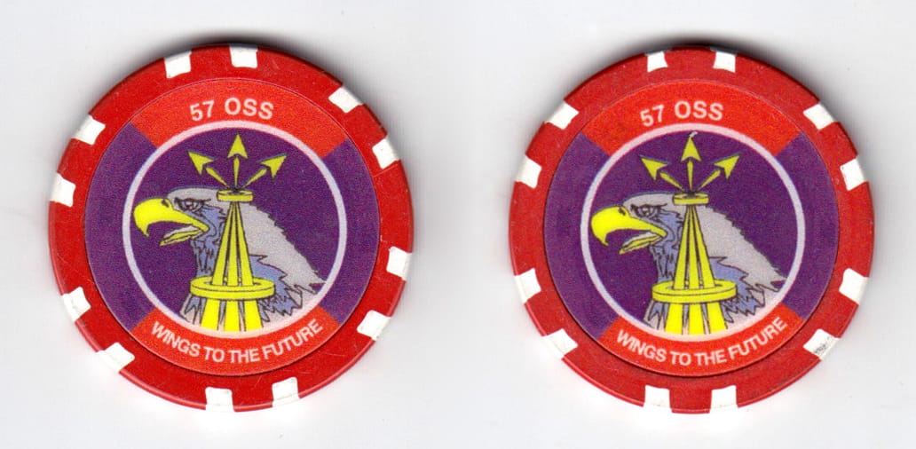 Round shaped poker chip, red and white in color, 1 1/2 inches in diameter.