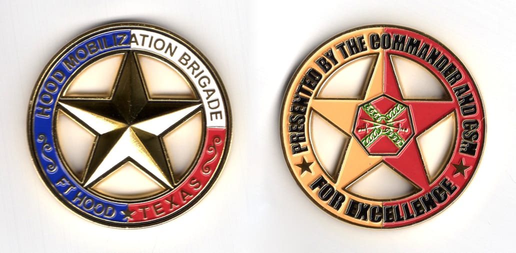 Round shaped coin, brass in color, 2 inches in diameter.