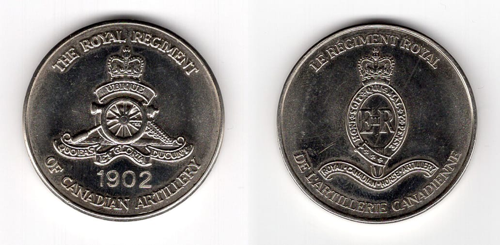 Round shaped coin, pewter in color, 1 1/2 inches in diameter.