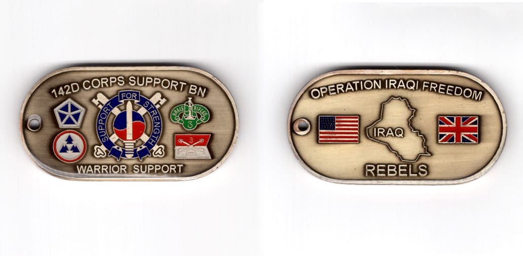 Dog tag shaped coin, antique brass in color, 1 1/4 inches high x 2 1/2 inches wide.