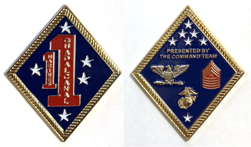 Diamond shaped, brass colored coin, 3 inches high x 1 1/2 inches wide