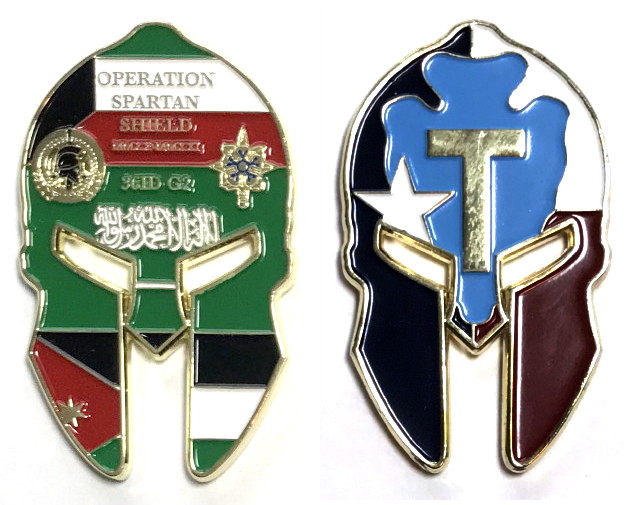 Brass colored metal coin, shaped like the outlie of an idealized Spartan helmet, 2 1/2 inches high x 1 1/2 inches wide