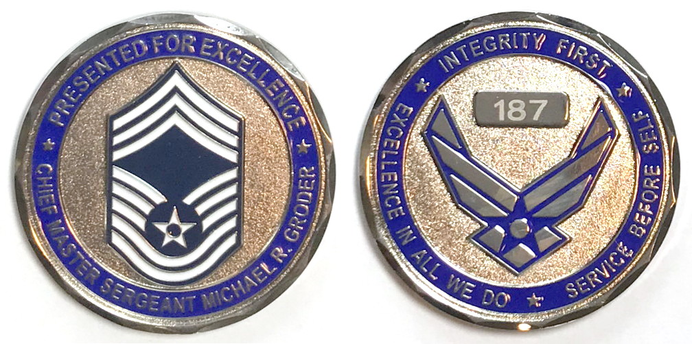 Round shaped coin, 2 inches in diameter, pewter in color.