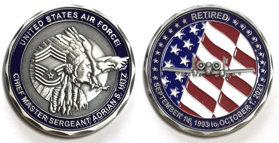 Round shaped coin, 2 inches in diameter, pewter in color.