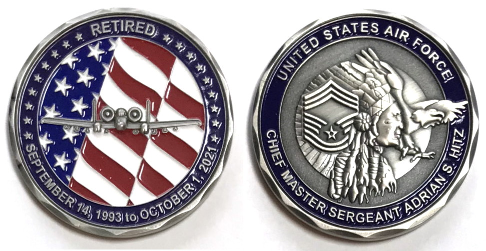 Round shaped coin, 2 inches in diameter, pewter in color.