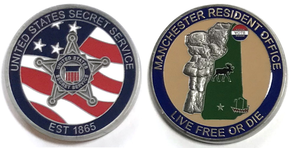 Round shaped coin, 1.75 inches in diameter, pewter in color.