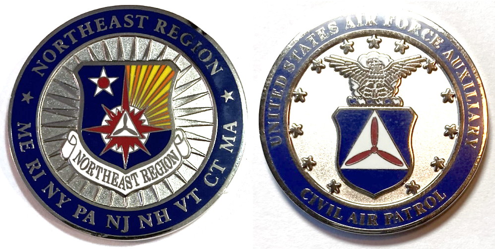 Round shaped coin, 1.5 inches in diameter, pewter in color.